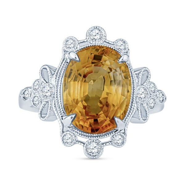 an oval cut citrine and diamond ring