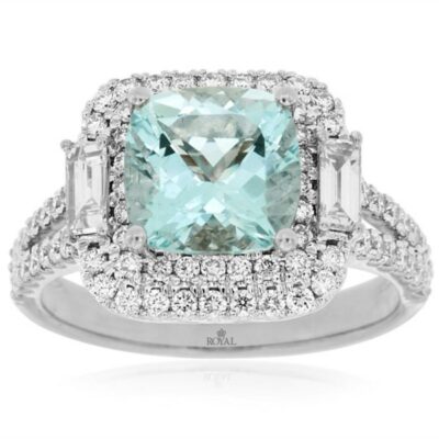 a ring with an aqua blue stone surrounded by white diamonds