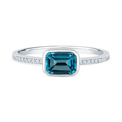 a blue diamond ring on a white background