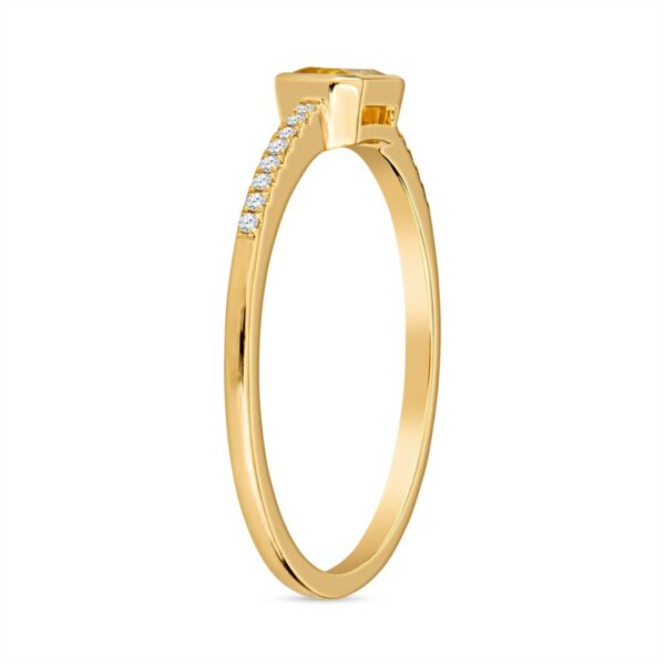 a yellow gold ring with diamonds on the side