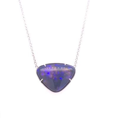 a necklace with a blue stone in the shape of a triangle