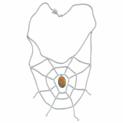 a necklace with a spider web design on it