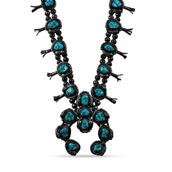 a long necklace with turquoise stones and black beads