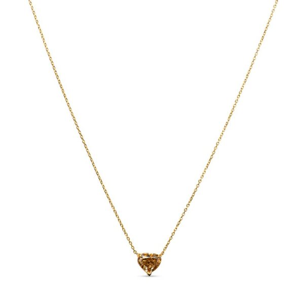 a gold necklace with a heart shaped pendant