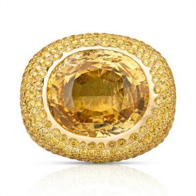 a large yellow diamond ring set in 18k gold