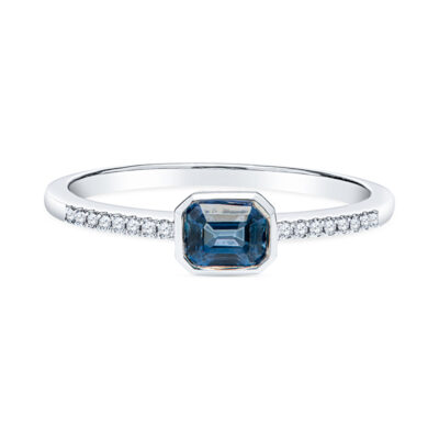 a blue diamond ring with diamonds around it