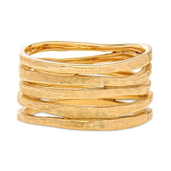 a stack of gold rings on a white background