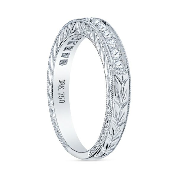a white gold wedding ring with engraved engraving