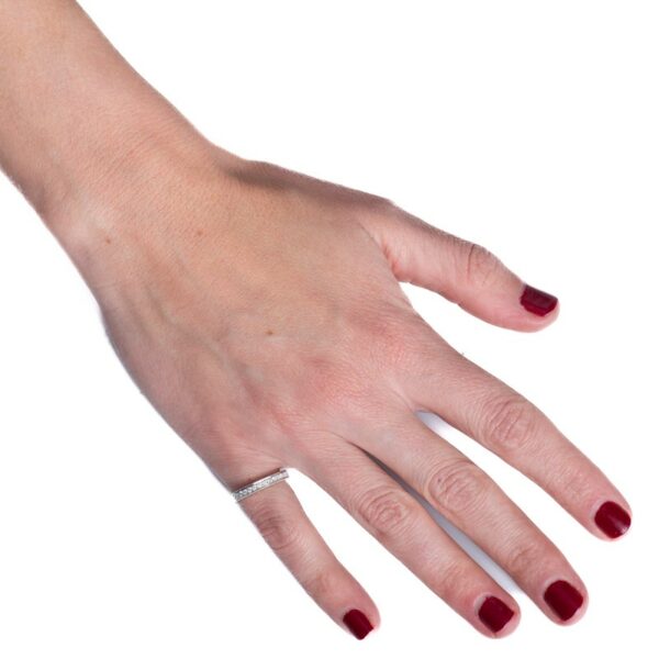 a woman's hand with red nail polish on it