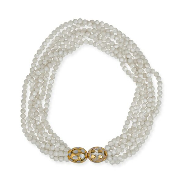 a white beaded necklace with gold clasp