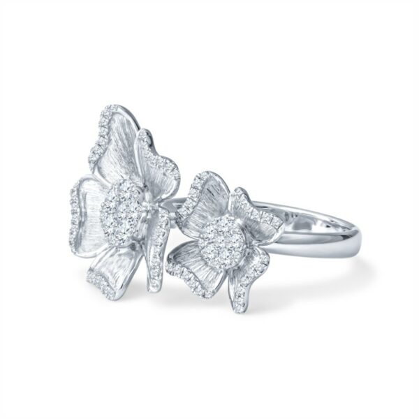 a white gold ring with two butterflies on it