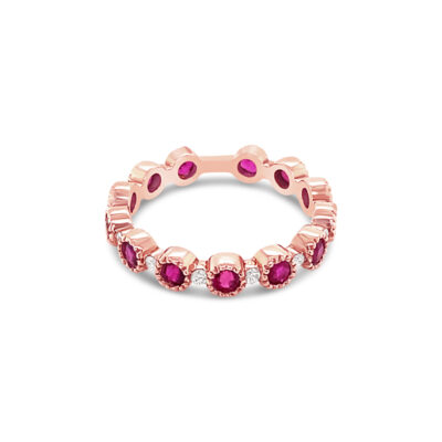 a rose gold ring with pink stones