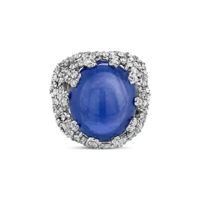 an oval blue stone surrounded by white diamonds