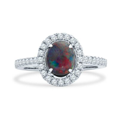 a ring with a black opal surrounded by diamonds