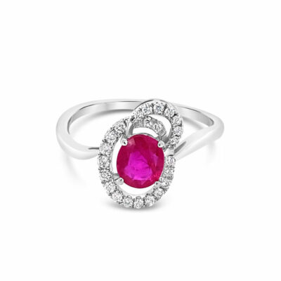 a white gold ring with an oval shaped ruby and diamonds