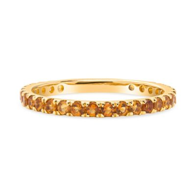 a yellow gold band with brown diamonds