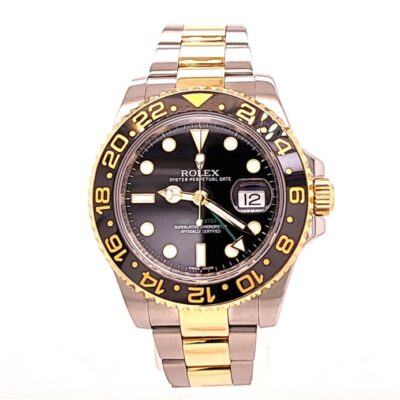 a rolex watch with two tone gold and black dials
