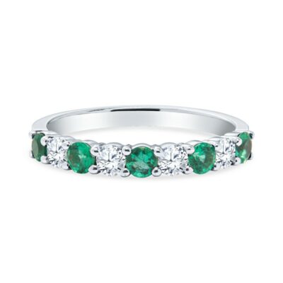 an emerald and diamond five stone ring