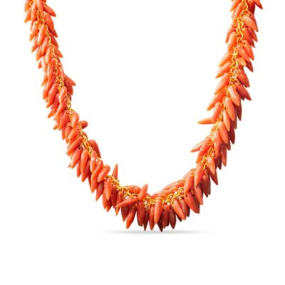 an orange necklace with gold chains and beads