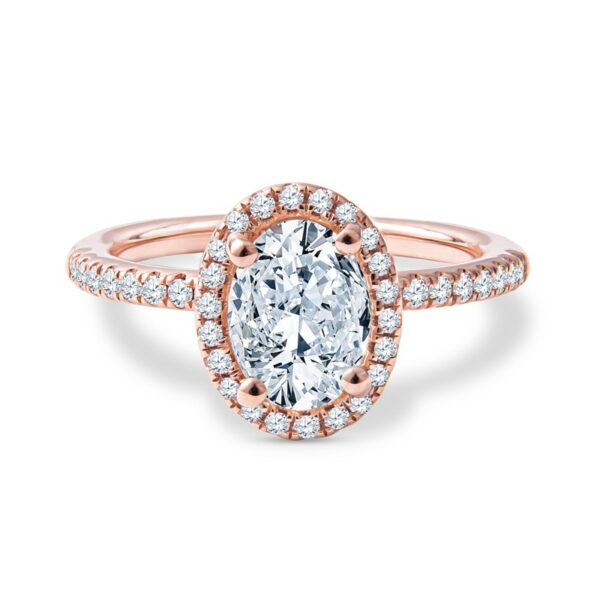 a rose gold engagement ring with an oval cut diamond in the center