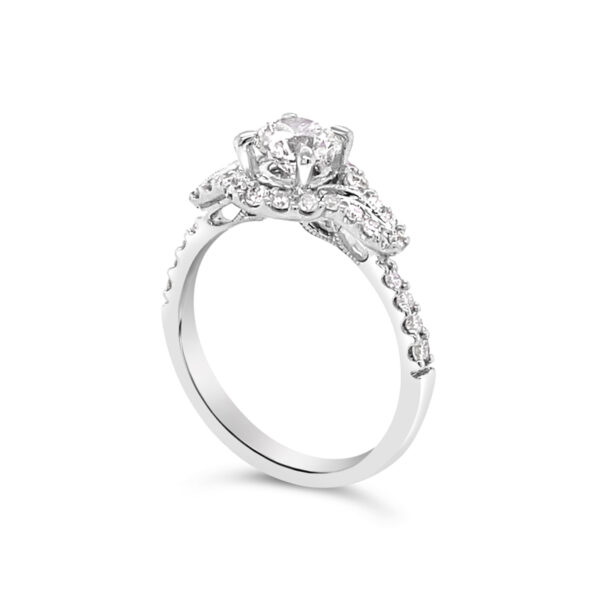 a white gold engagement ring with an oval diamond center