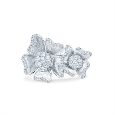 a white gold and diamond ring with flowers