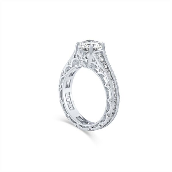 a white gold engagement ring with an intricate design