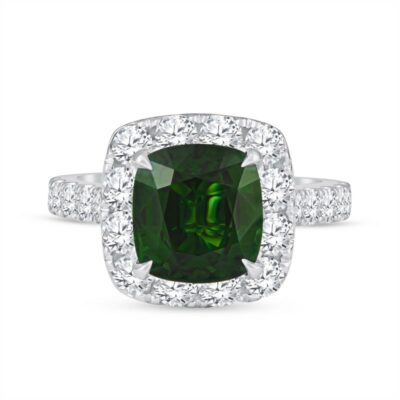 a cushion cut green diamond surrounded by diamonds