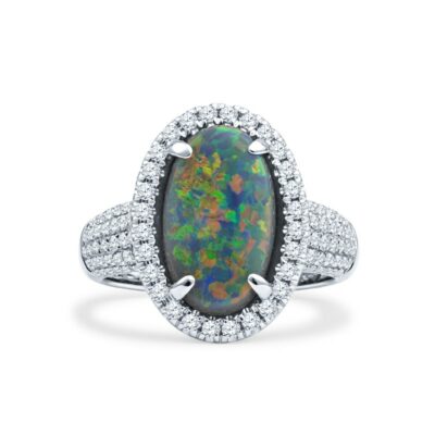 an oval opal and diamond ring in white gold