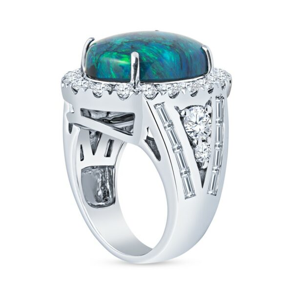 a white gold ring with a black opal and diamonds
