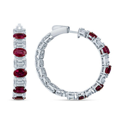 a pair of hoop earrings with red and white stones