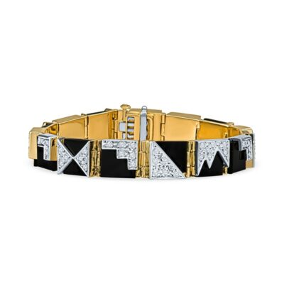 a gold bracelet with black and white stones