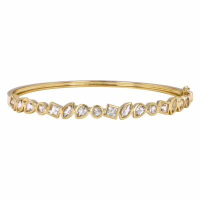 a yellow gold bang bracelet with white stones