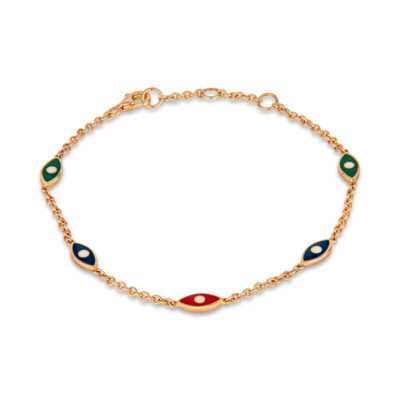a gold bracelet with two evil eyes on it