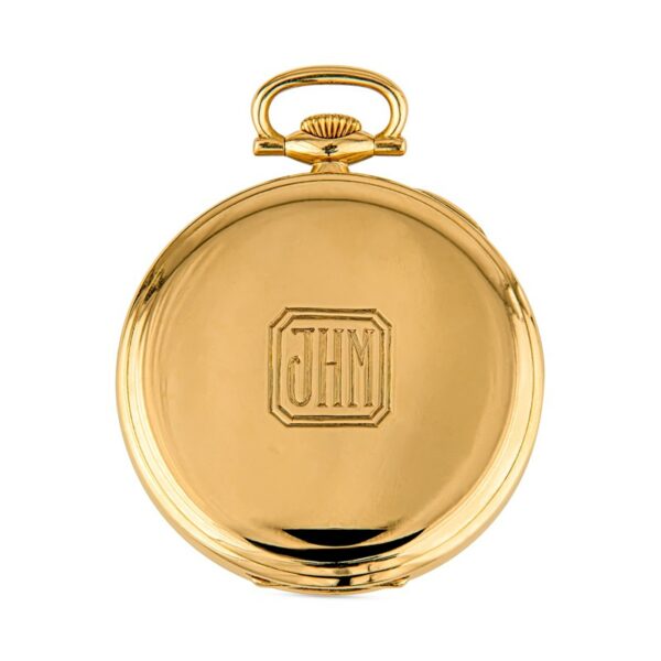 a gold pocket watch with the initials gh on it