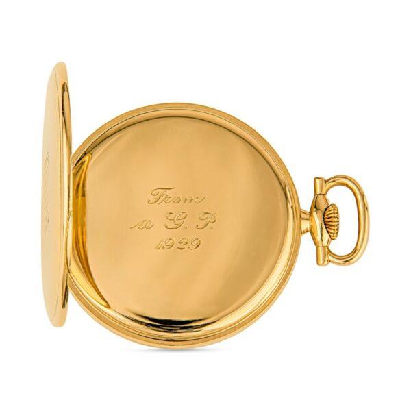 a gold pocket watch on a white background