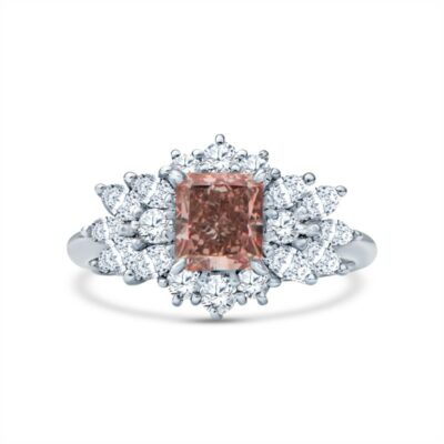 a pink diamond ring with white diamonds around it