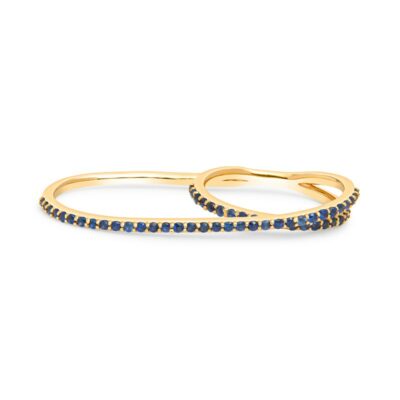 two gold rings with blue sapphire stones