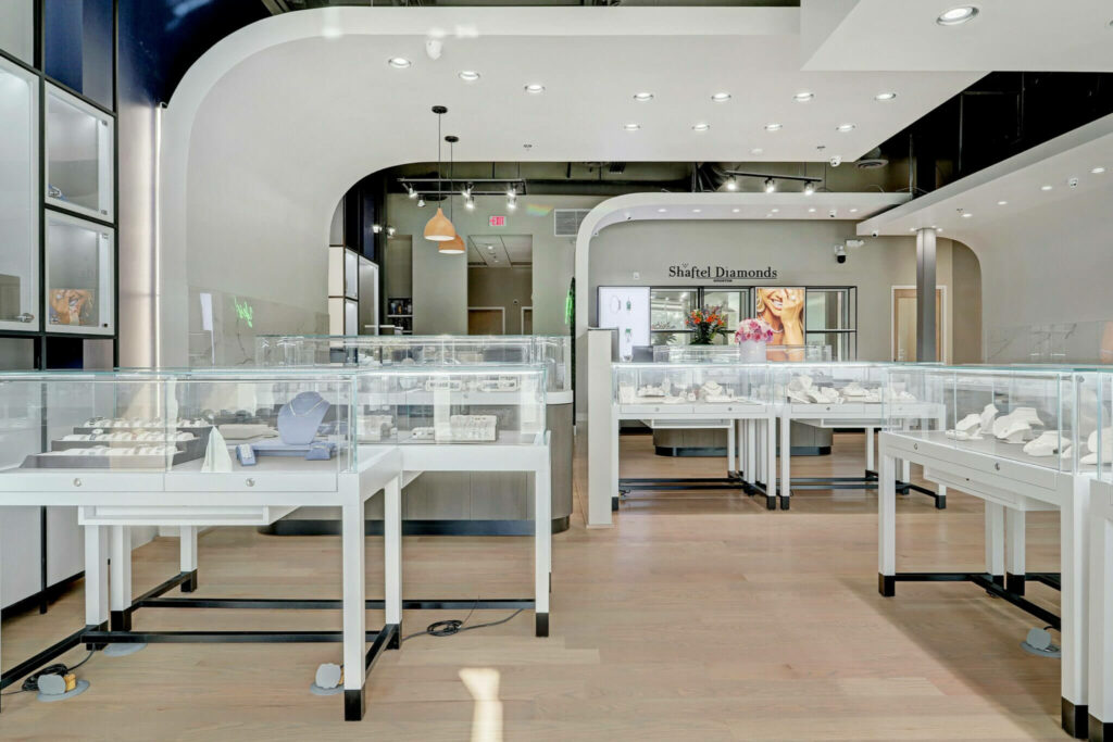 a room filled with lots of white tables covered in glass