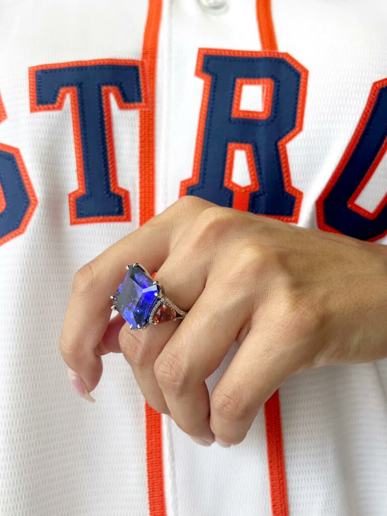a person wearing a ring with a star on it