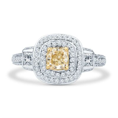 a fancy yellow diamond ring set in white gold