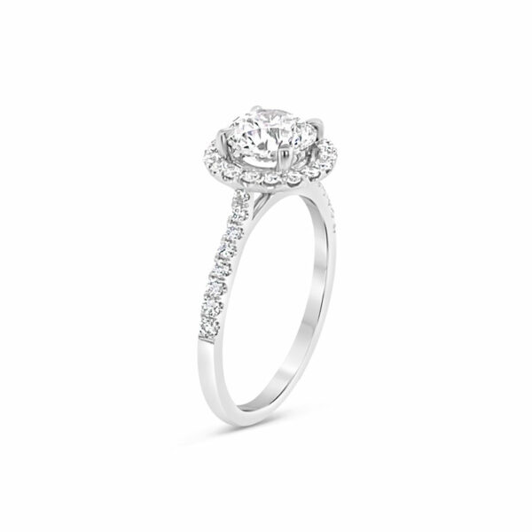 a white gold ring with an oval diamond center