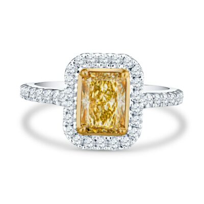 a fancy yellow diamond ring with diamonds around it
