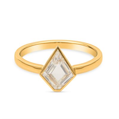 a yellow gold ring with a white diamond