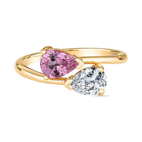 two pear shaped diamonds on a yellow gold ring
