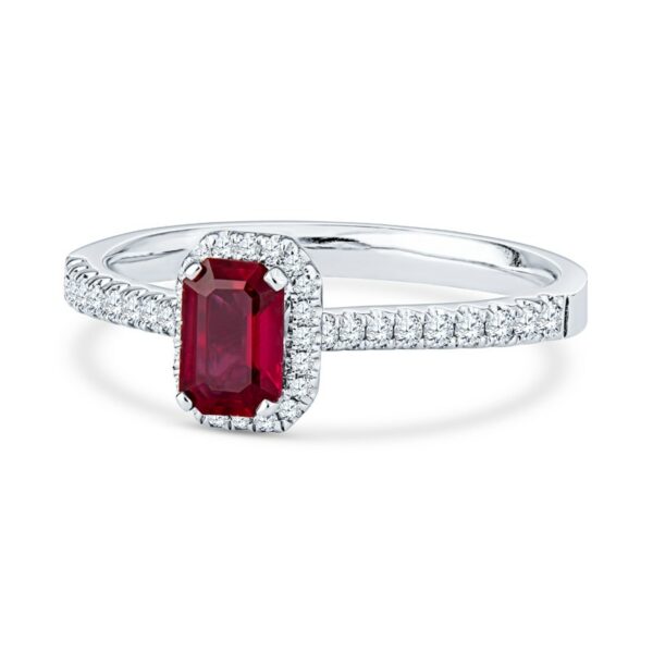 a ring with a red stone surrounded by diamonds