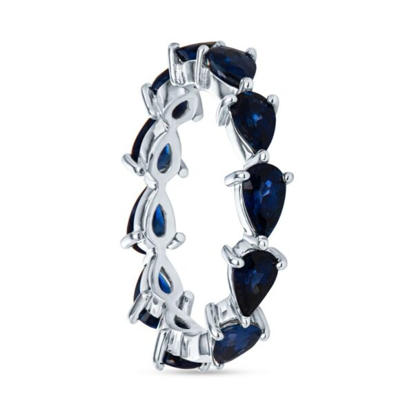a ring with three pear shaped blue sapphire stones