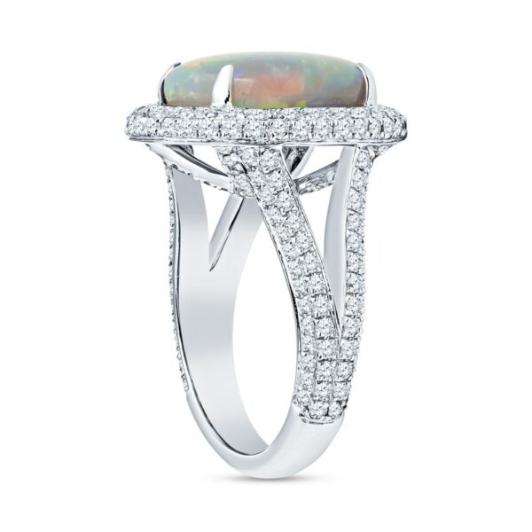 a ring with an opal and diamonds on it