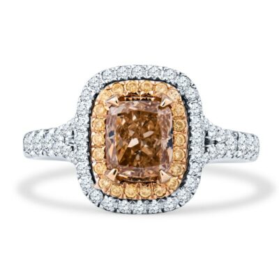 a fancy ring with an orange diamond surrounded by white and yellow diamonds