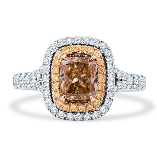 a fancy ring with an orange diamond surrounded by white and yellow diamonds